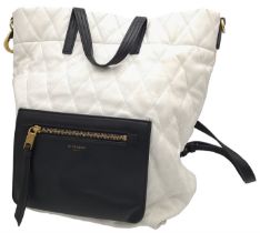 A Givenchy Black and White Duo Backpack. Quilted leather exterior with gold-toned hardware, a zipped