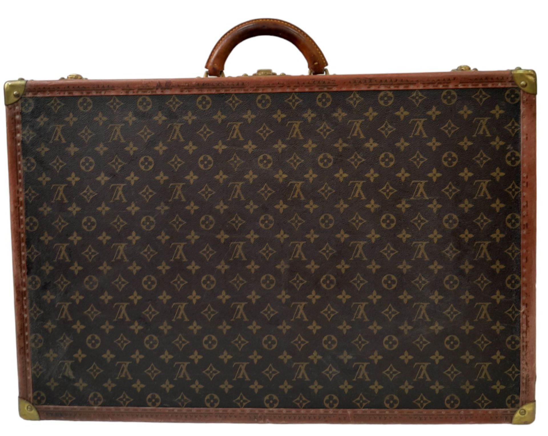 A Vintage Possibly Antique Louis Vuitton Suitcase. The last lot of our LV trilogy. Canvas monogram