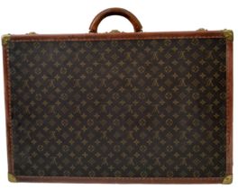 A Vintage Possibly Antique Louis Vuitton Suitcase. The last lot of our LV trilogy. Canvas monogram