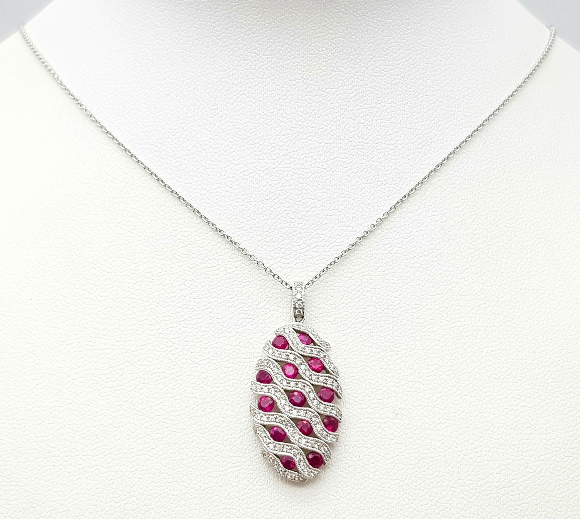 AN 18K WHITE GOLD DIAMOND AND RUBY PENDANT - 0.49CT OF DIAMONDS AND 2.29CT OF RUBIES. 6.2G WEIGHT. - Image 8 of 16