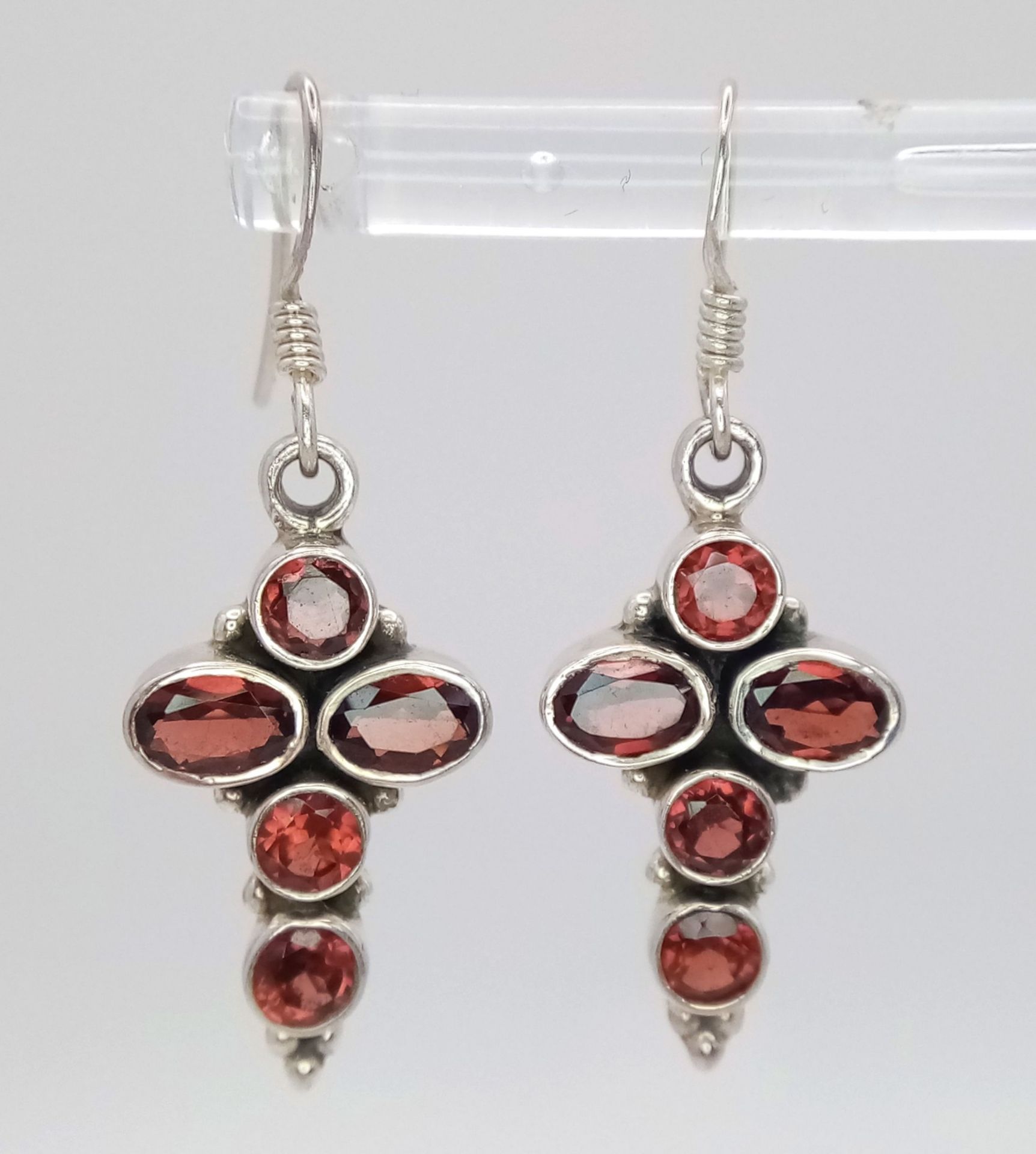 A Pair of Sterling Silver Garnet Set Cross Earrings. 3.5cm drop. 1.4cm Wide and set with 5 Round and - Image 2 of 5