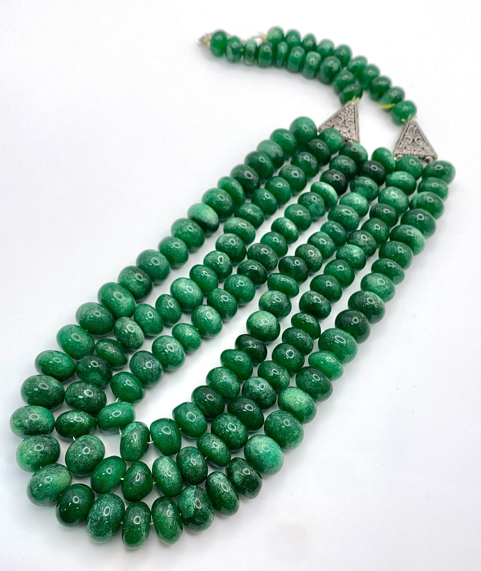 A Tibetan silver necklace with three rows of substantial round emerald cabochons accompanied by a - Image 2 of 4