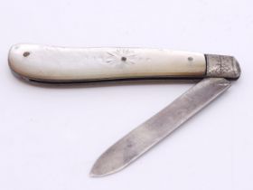 An antique sterling silver folding knife with Mother of Pearl inlay handle. Full Sheffield