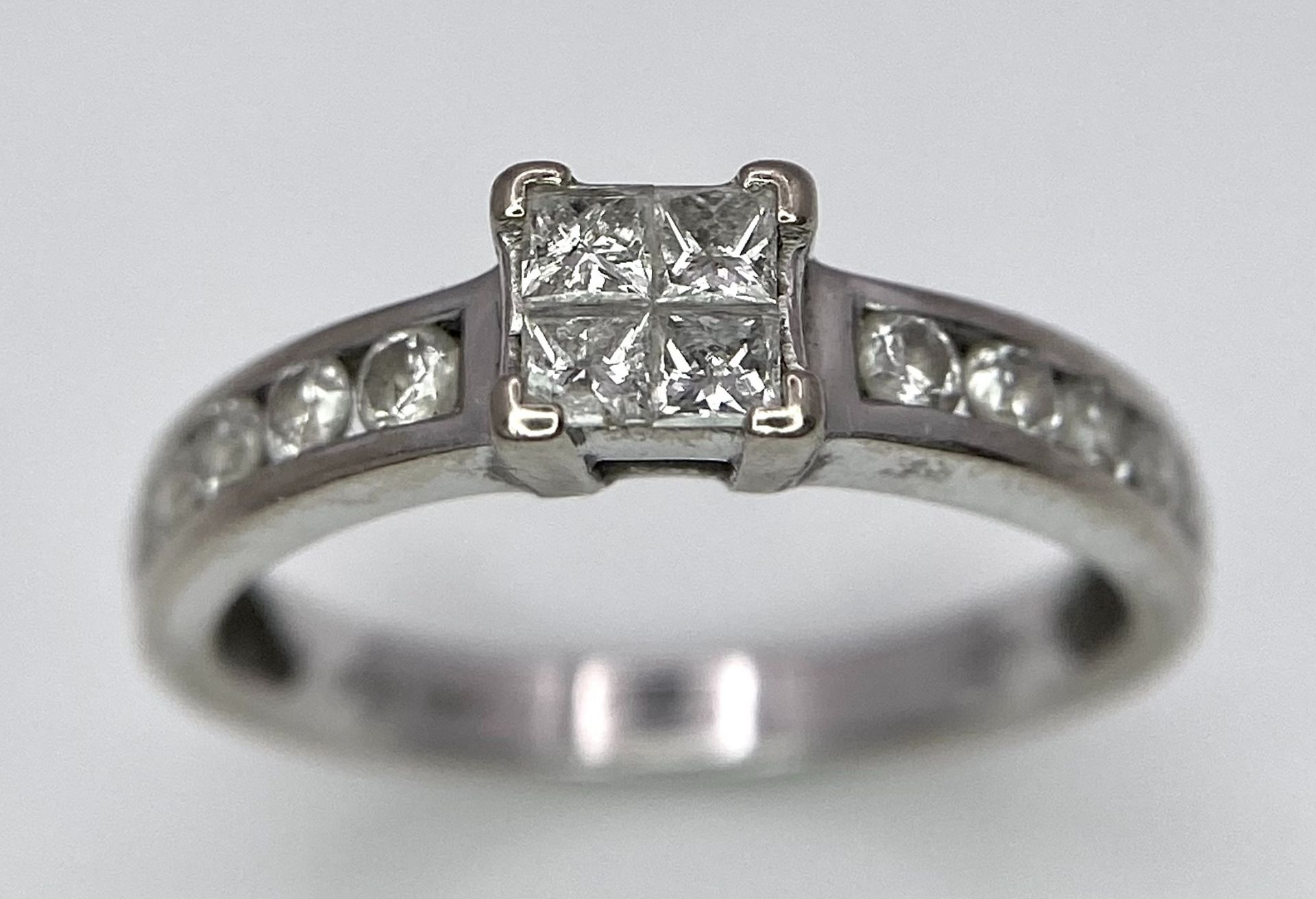 An 18K White Gold and Diamond Ring. Square and round cut diamonds. Size J. 2.6g total weight. - Image 2 of 7