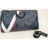 A Louis Vuitton America's Cup Oversized Keepall. Damier canvas in dark blue with a 'V' Gaston logo -