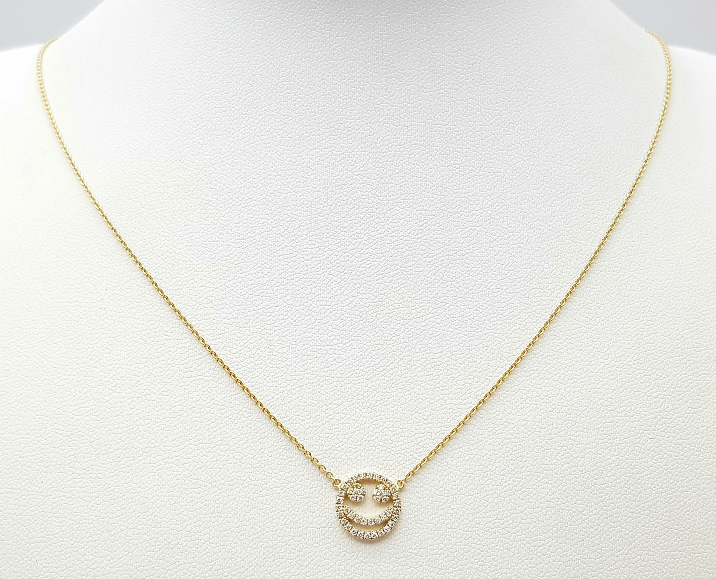 An 18K Gold Diamond Smiley Face Pendant on an 18K Yellow Gold Disappearing Necklace. 1cm diameter - Image 2 of 7