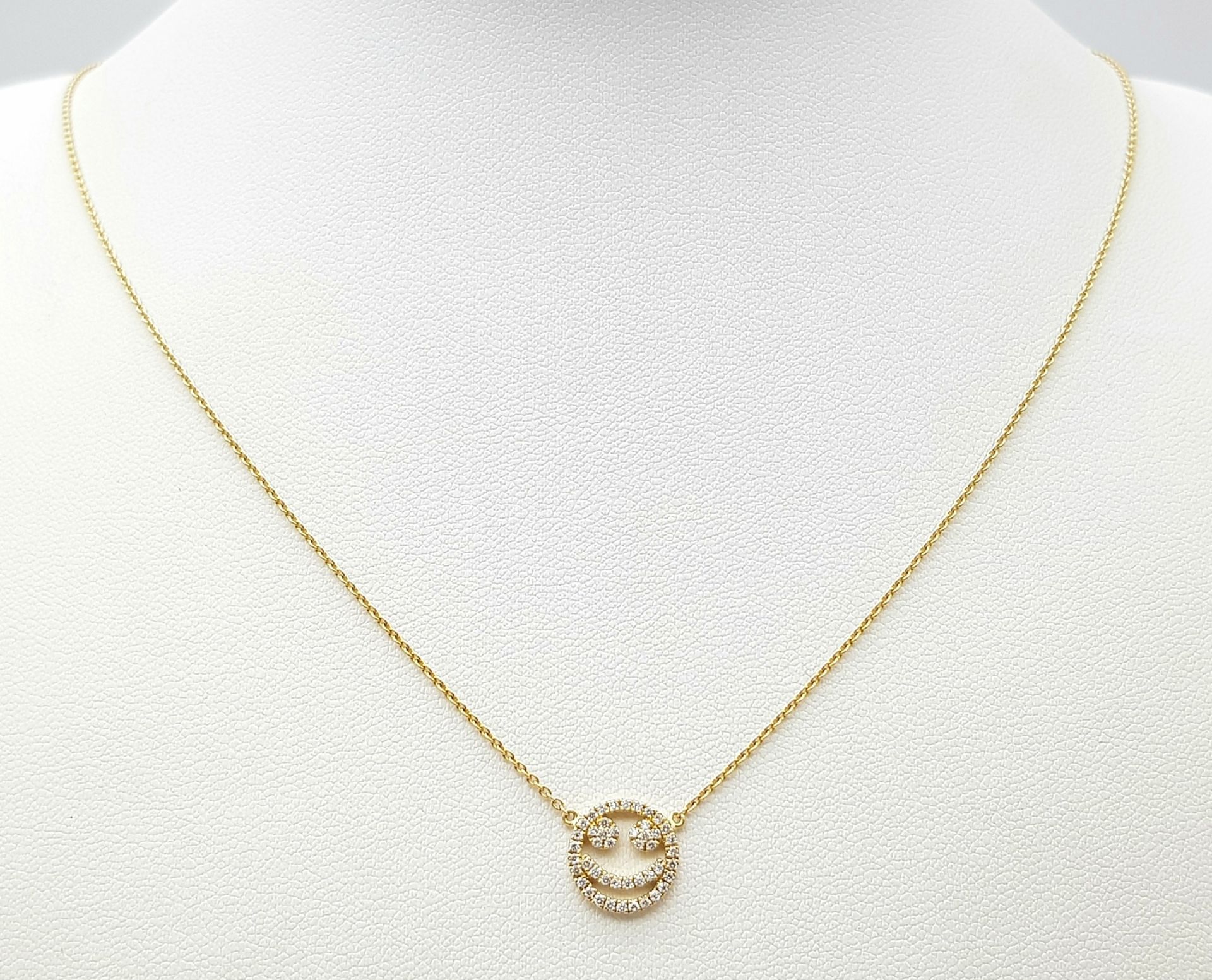 An 18K Gold Diamond Smiley Face Pendant on an 18K Yellow Gold Disappearing Necklace. 1cm diameter - Image 2 of 7