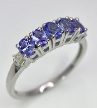 A Tanzanite and Diamond Ring. Set in 925 silver. Size O.