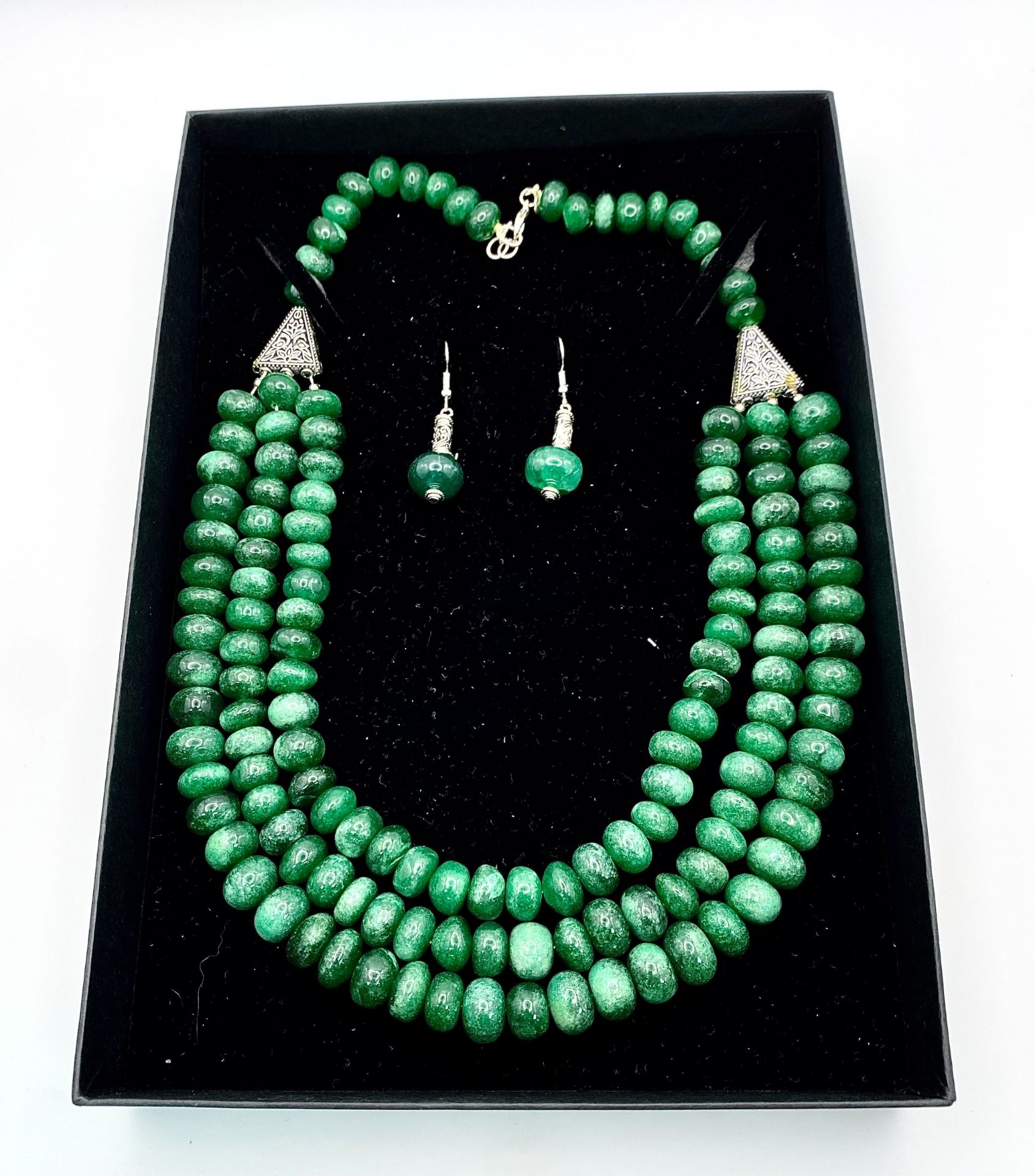 A Tibetan silver necklace with three rows of substantial round emerald cabochons accompanied by a - Image 4 of 4