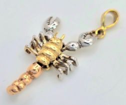 A 14K 3 COLOUR ARTICULATED SCORPION CHARM. 3.5cm length, 3g total weight. Ref: SC 8050