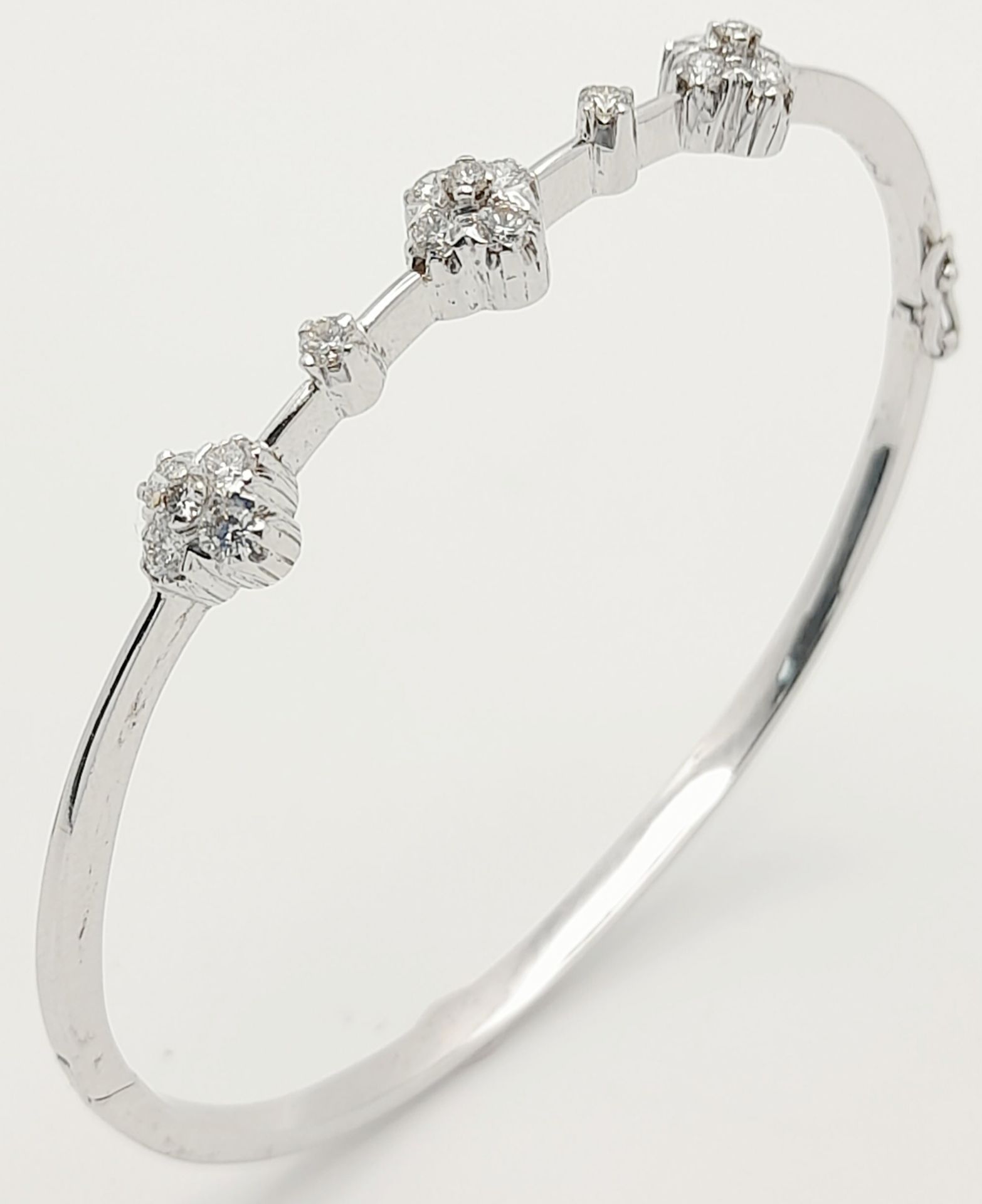 AN 18K WHITE GOLD DIAMOND SET BANGLE. 0.30ctw, 5.1cm inner diameter, 8.5g total weight. Ref: SC 8069 - Image 5 of 7