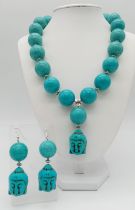 Of Buddhist interest: A large beaded (20 mm diameter) turquoise coloured necklace and earrings set