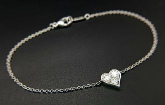 A 950 Platinum Delicate Tiffany and Co. Diamond Heart Bracelet. 16cm. 2.35g total weight. Ref: