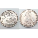 An 1887 Queen Victoria Silver Crown Coin. VF grade but please see photos.