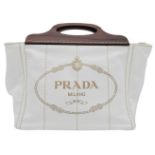A Prada White Exteriors with Brown Wooden Handle Logo-printed Striped Tote Bag. Vertical