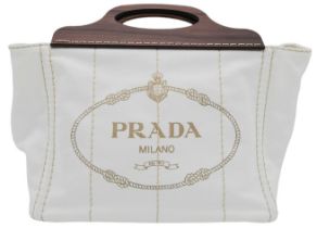 A Prada White Exteriors with Brown Wooden Handle Logo-printed Striped Tote Bag. Vertical