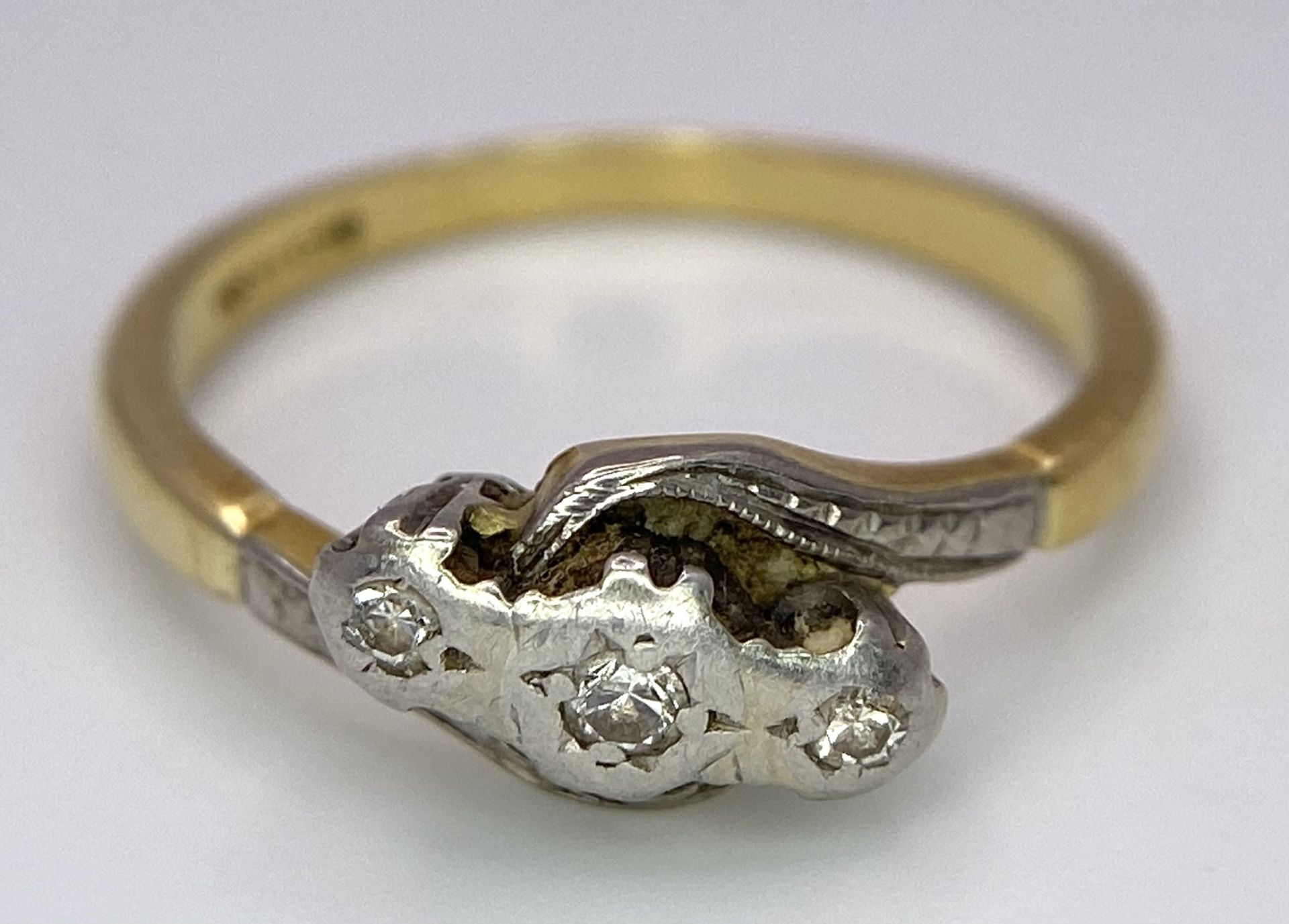A Vintage 18K Yellow Gold, Platinum and Old Cut Diamond Crossover Ring. Three old cut gypsy-set - Image 4 of 6