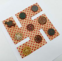 WW2 German Set of 9 Runic Plastic Tinnie Badges on original card.