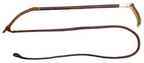 A Vintage Bone Handled Riding Whip. Hard bone gives way to entwined leather - All topped off with