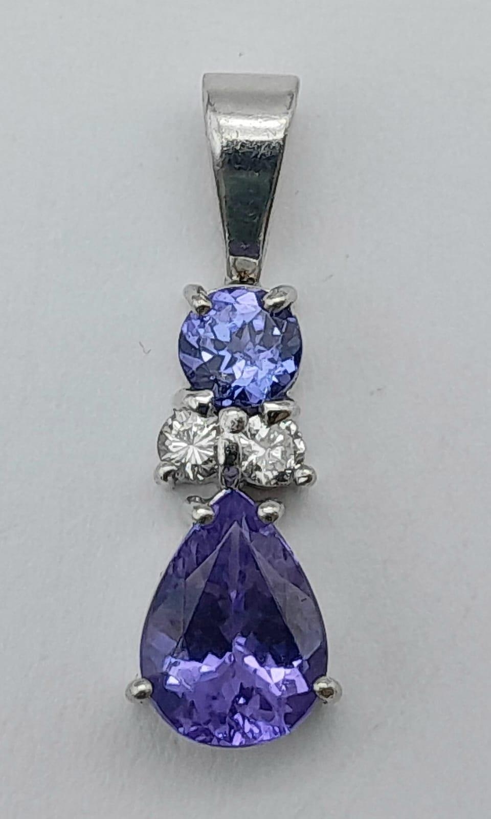 A Platinum, Tanzanite and Diamond Pendant. A beautiful teardrop blue tanzanite with round cut - Image 2 of 3