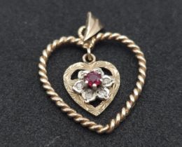 A 9K Yellow Gold and Ruby Floating Heart Pendant. 3cm. 1.8g.