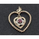 A 9K Yellow Gold and Ruby Floating Heart Pendant. 3cm. 1.8g.