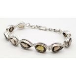 A Silver Smoky Quartz Tennis Bracelet. Set in 925 Sterling silver. 39ctw. W- 19.4g. Ref: HV2242