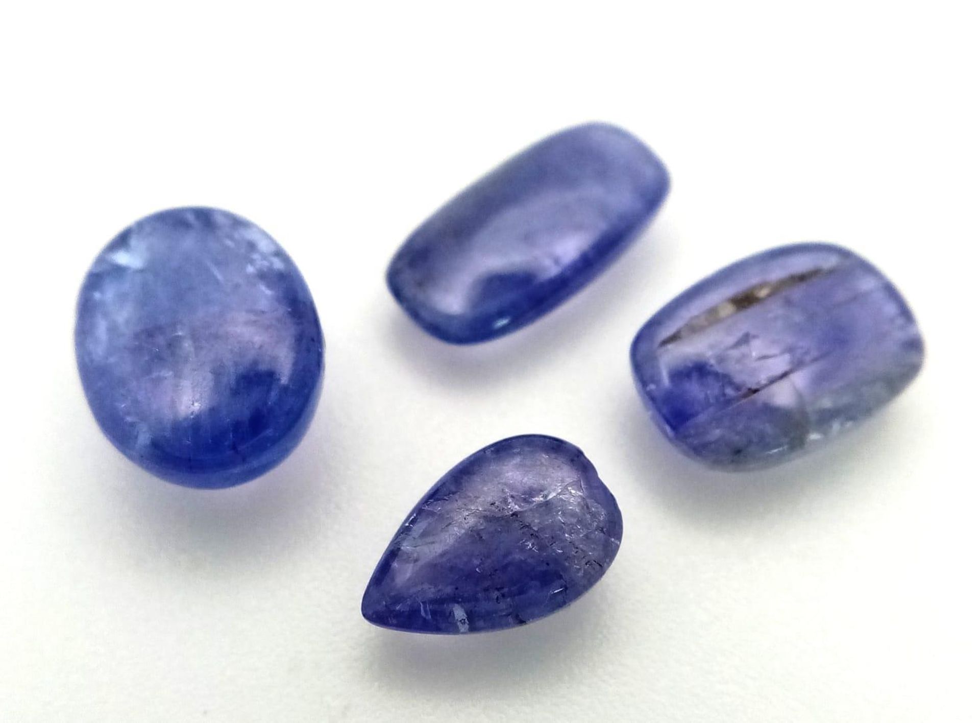 A 10ct Cabochon Tanzanite Gemstones Lot of 4 Pieces. Mixed Shapes. - Bild 2 aus 3