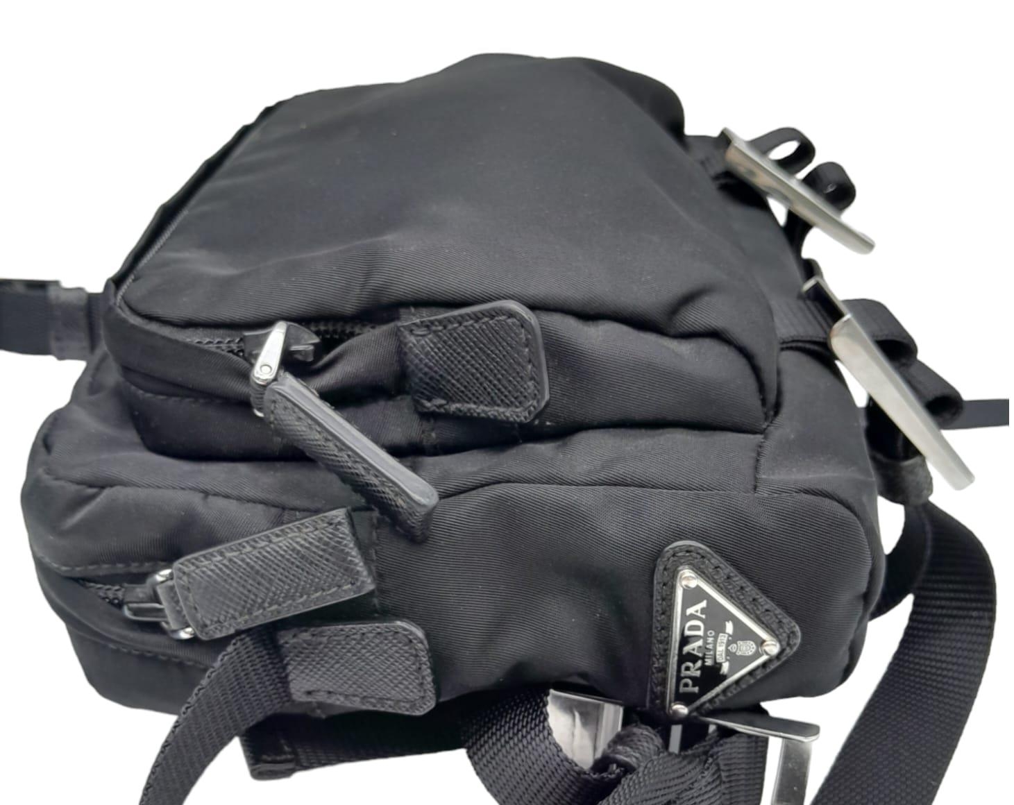 A Prada Black 'Tessuto Montagna' Crossbody Bag. Textile exterior with silver-toned hardware, a - Image 7 of 11