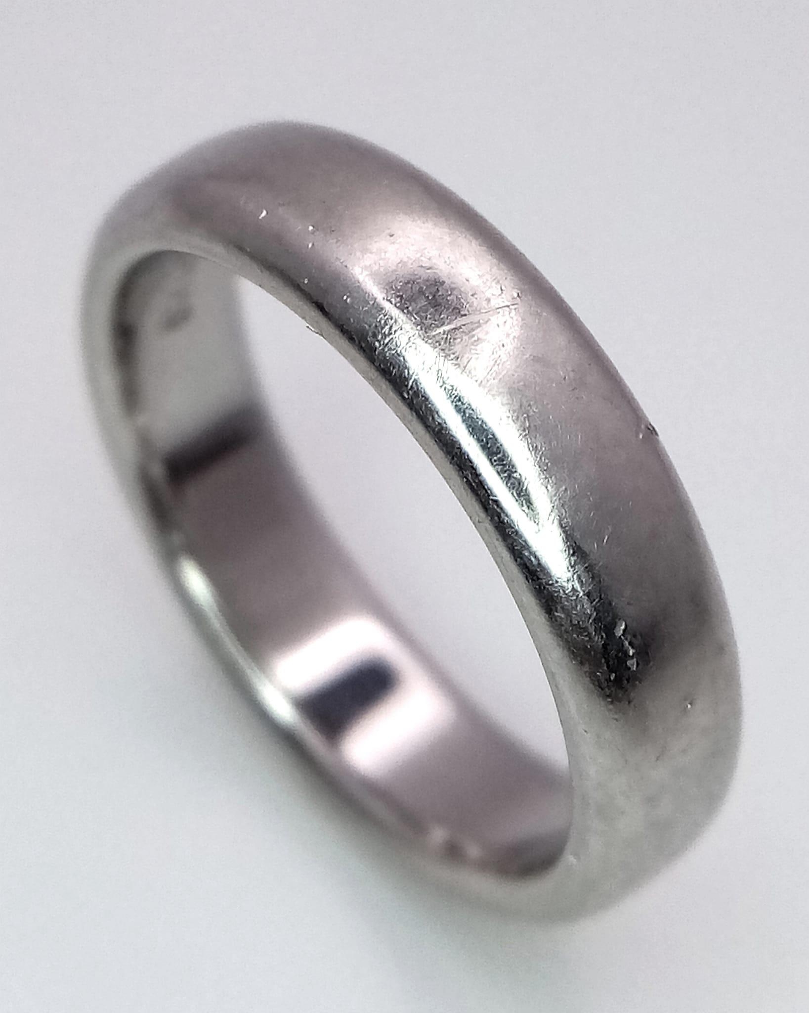 Tiffany and Co Platinum 4mm rounded band ring. 8.2g. Size K.