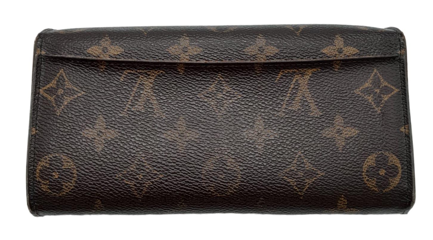 A Louis Vuitton Monogram Wallet. Leather exterior with an open compartment on back and press stud - Image 2 of 10