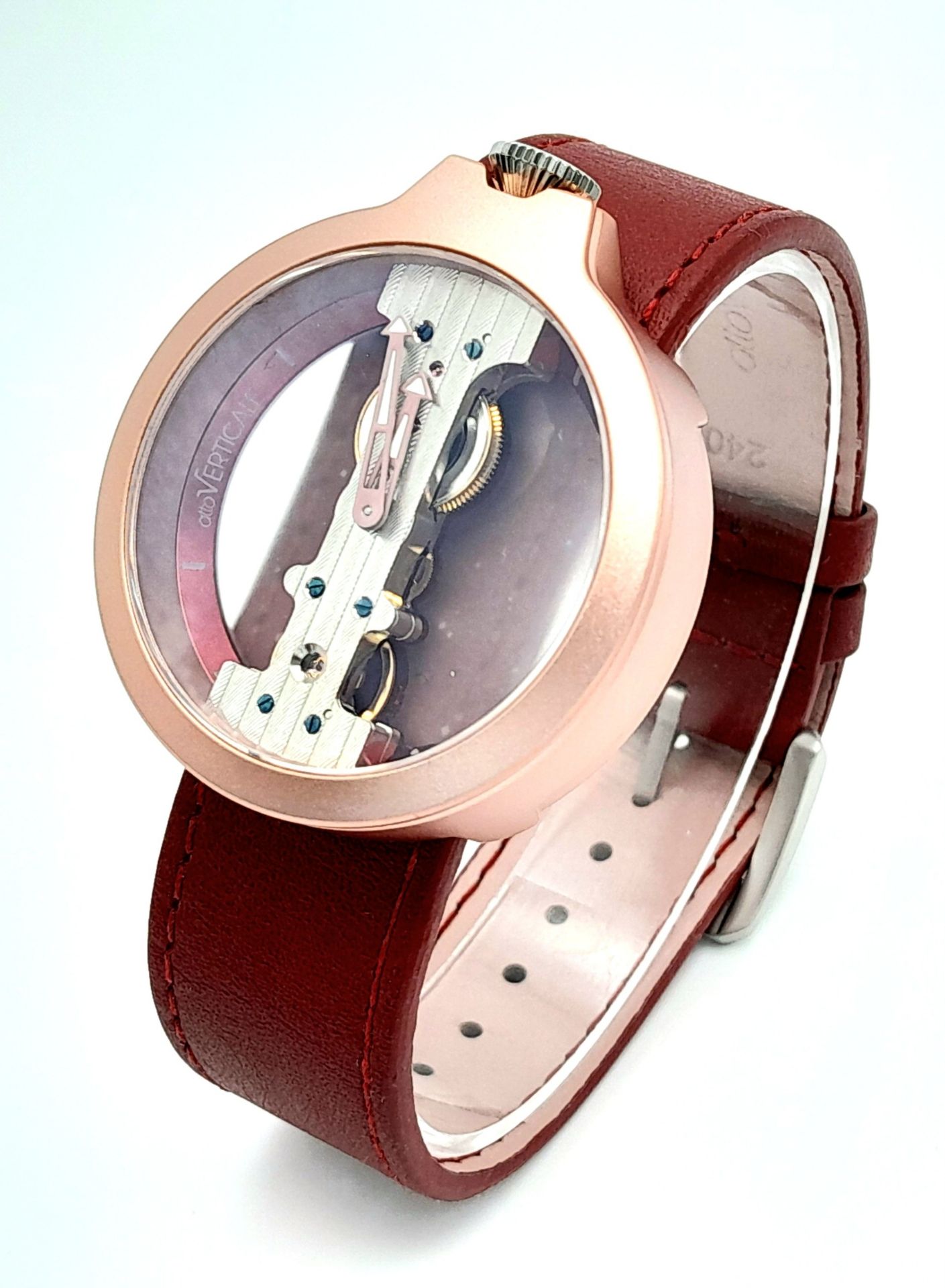 A Verticale Mechanical Top Winder Gents Watch. Red leather strap. Ceramic rose gold skeleton