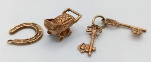 Three 9K Gold Pendants/ Charms - Pram, keys and lucky horseshoe! 2.76g total weight.