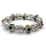 A Tibetan Silver and Multi Coloured Jade Bracelet. Deity shaped links with jade cabochon spaces.