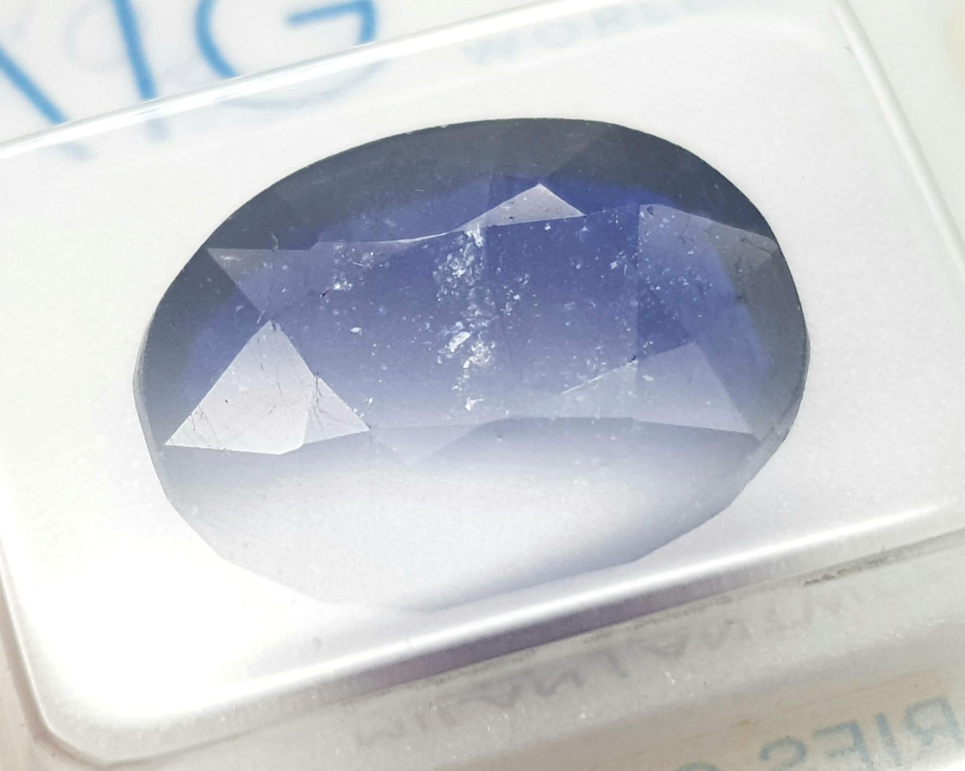 An 11.35ct Blue Sapphire - AIG Milan Certified in a Sealed Container. - Image 2 of 5