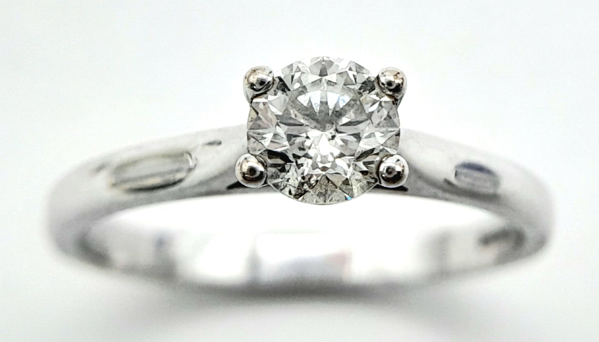 An 18K White Gold Diamond Solitaire Ring. 0.50ct brilliant round cut, slightly tinted. Size N. 2. - Image 2 of 6
