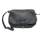 A Prada Black Leather Crossbody Satchel Bag. Textured exterior with buckled flap. Spacious leather