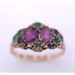 A 15K YELOW GOLD ANTIQUE AMETHYST & EMERALD RING. HALLMARKED BIRMINGHAM 1924, EXACTLY 100 YEARS OLD.