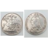 An 1890 Queen Victoria Silver Crown Coin. VF grade but please see photos.