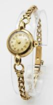 A Vintage 9K Yellow Gold Renown Ladies Watch. 9K gold bracelet and case - 18mm. Patinaed dial.