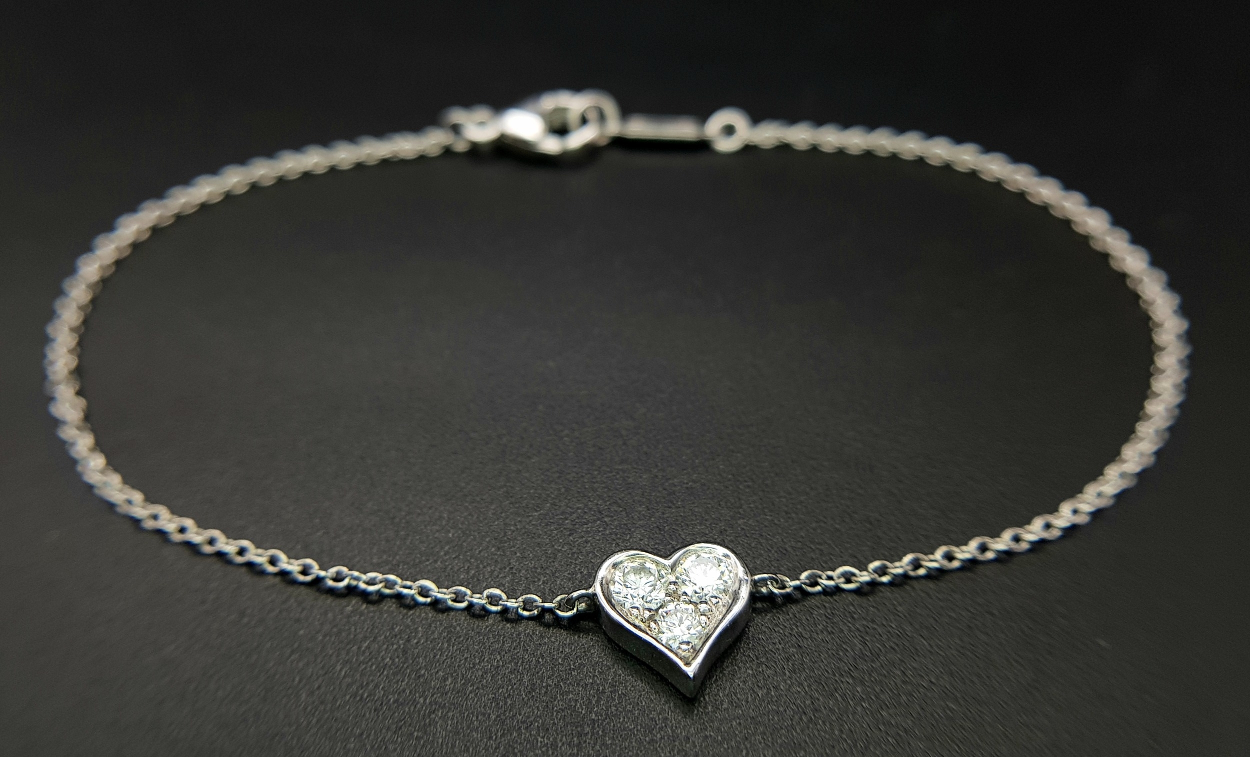 A 950 Platinum Delicate Tiffany and Co. Diamond Heart Bracelet. 16cm. 2.35g total weight. Ref: - Image 7 of 7
