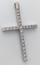 AN 18K WHITE GOLD DIAMOND SET CROSS PENDANT. 0.25ctw, 2.5cm length, 1.1g total weight. Ref: SC 8073