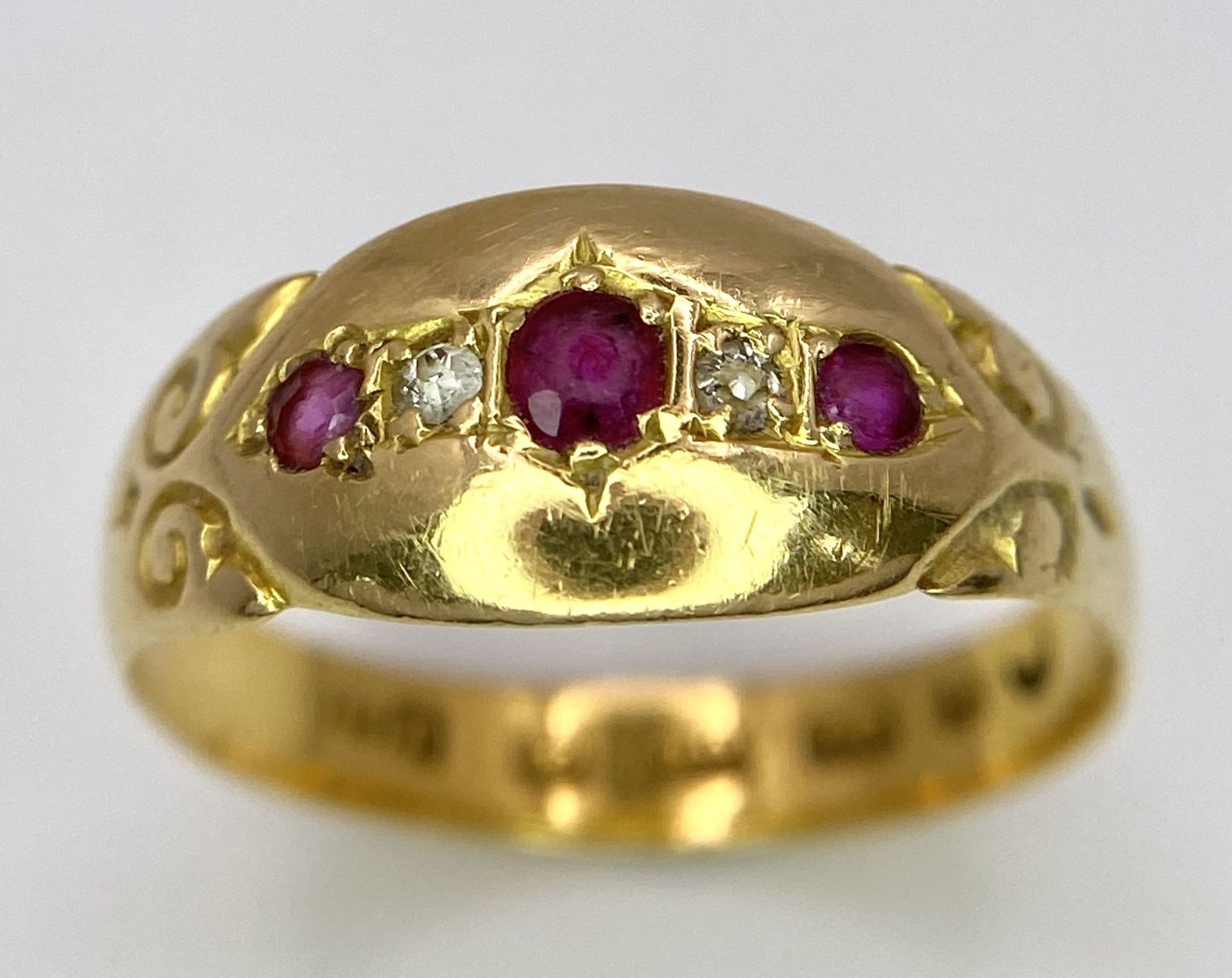 An Antique 22K Yellow Gold Ruby and Diamond Ring. Size M. 2.6g total weight.