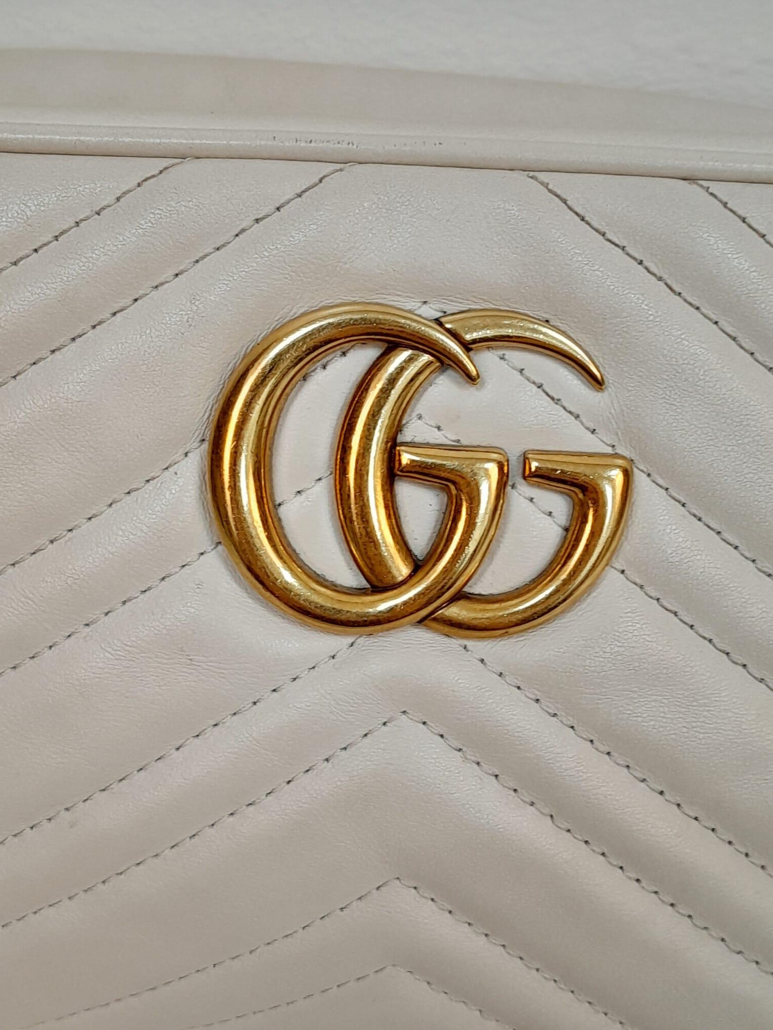 A Gucci Ivory GG Marmont Cross Body Bag. Quilted leather exterior with gold-toned hardware, chain - Image 5 of 10