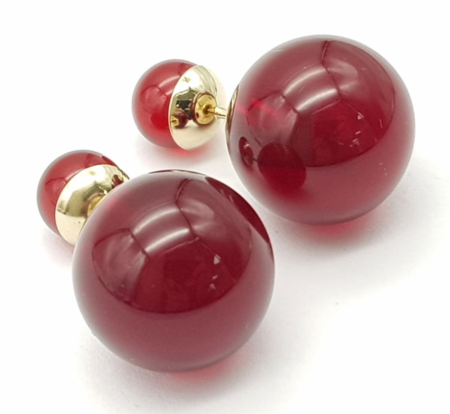 A Pair of Dior Cherry Red Orb Earrings. Comes in Dior packaging.