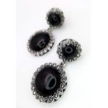 A Pair of 925 Silver, Black Onyx and Marcasite Drop Earrings. 3cm drop. Comes with a presentation