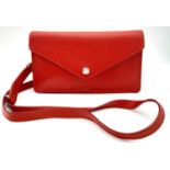 A Tommy Hilfiger Red Wallet Crossbody Bag. Leather exterior with silver-toned hardware, removeable