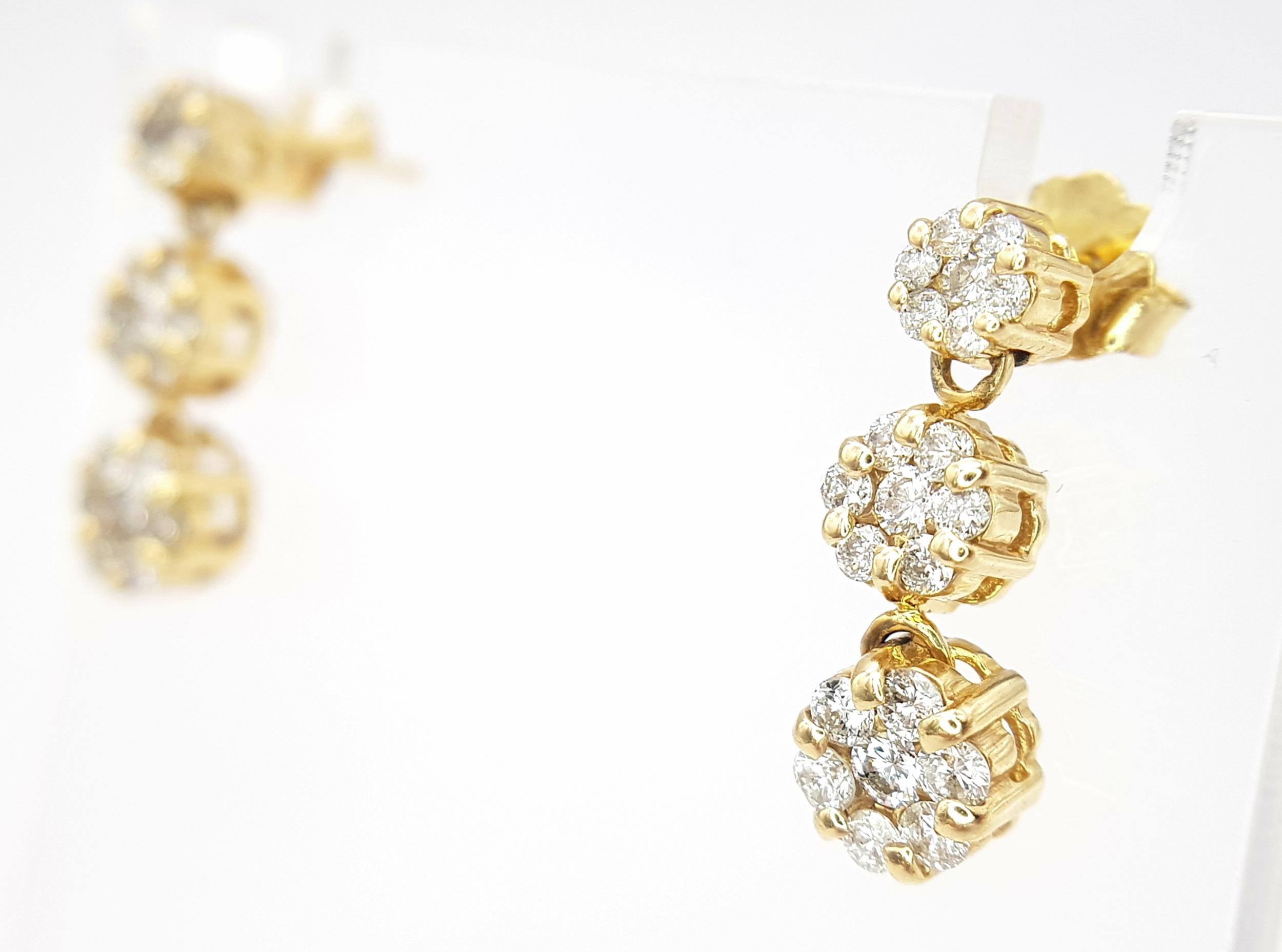 A Pair of 14K Yellow Gold and Diamond Drop Earrings. A total of 42 round cut diamonds - 1ctw. H-I in - Image 2 of 8