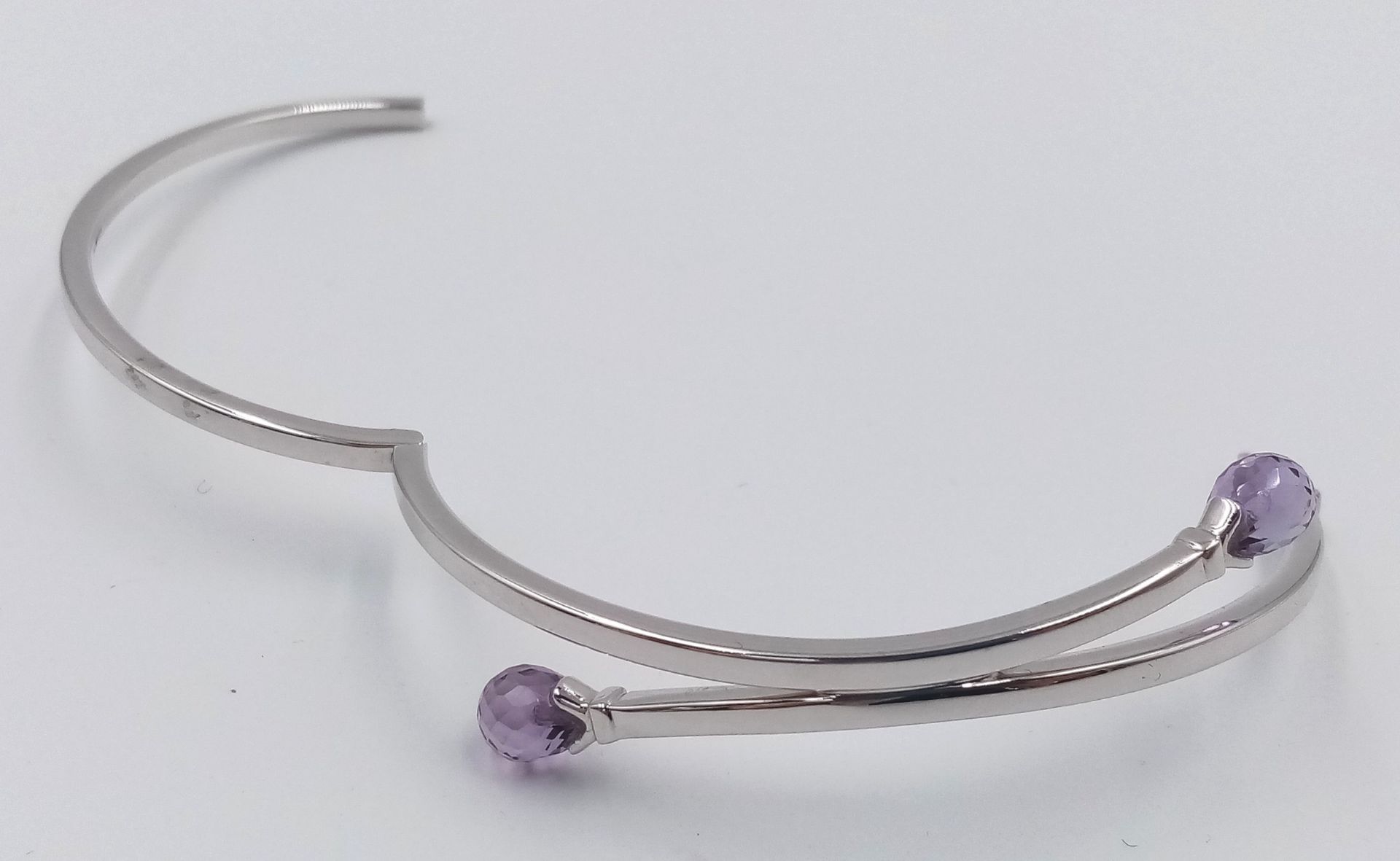 A 9K WHITE GOLD AMETHYST SET BANGLE. 8.1G. - Image 2 of 4