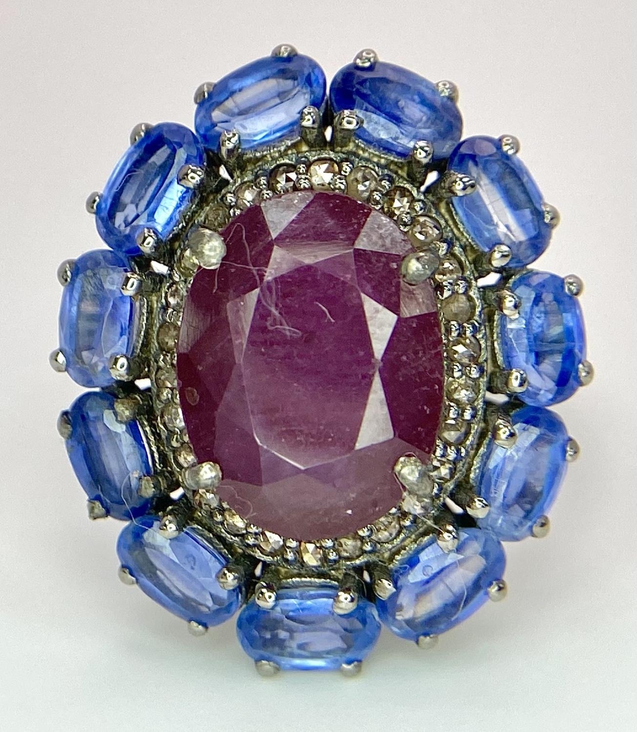 A 5.65ct Ruby Dress Ring with Halo of 0.40ctw of Diamonds and 3.70ct of Kyanite Stones. Set in 925 - Image 3 of 7